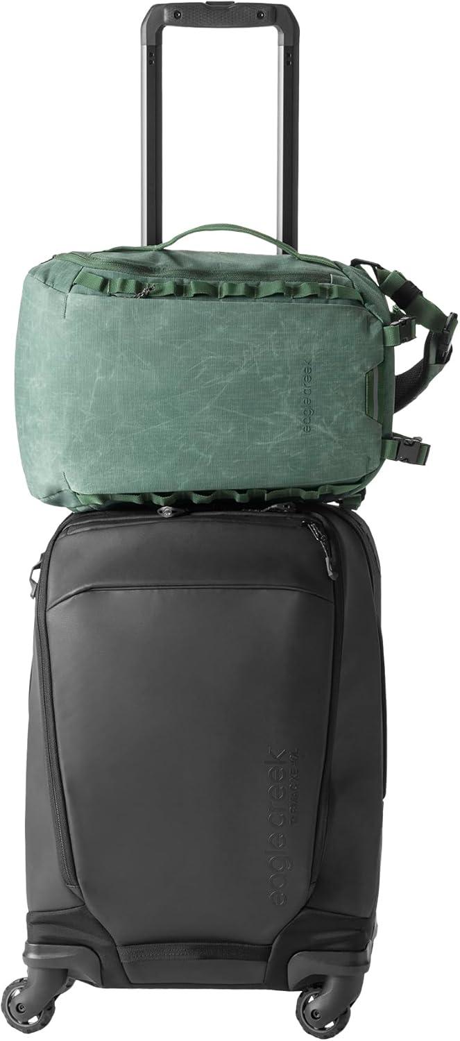 imageeagle creek Explore Sling Pack Compact Crossbody Sling Bag With Cushioned Back Panel Reinforced Side Grab Handle ampamp Stretchy Mesh Side Pockets Travel Accessories BlackGrass Green